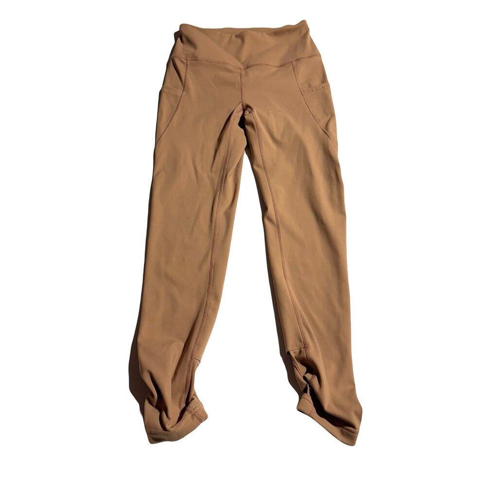 Free People Movement Women’s Leggings Size XS Tan Cutout Twist Hems Pockets